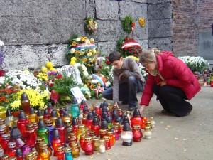 Tributes being laid at the wall where thousands were shot dead.