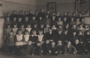  Poland 1932. 56 well mannered primary school children including theatre director Mikolaj Wozniak’s own grandmother. The classes included many Jewish children who were directly affected by the Holocaust. 