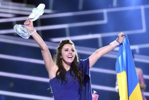 Ukraine's Jamala celebrates with the trophy after winning the Eurovision Song Contest final with the song '1944' in Stockholm, Sweden, Sunday, May 15, 2016. (AP Photo/Martin Meissner)