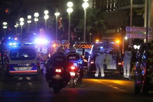 Police officers and rescue workers arrive at the scene of an attack on July 14, 2016, after a van ploughed into a crowd leaving a fireworks display in the French Riviera town of Nice. The mayor of the French city of Nice said dozens of people were likely killed after a van rammed into a crowd marking Bastille Day in the French Riviera resort today and urged residents to stay indoors. / AFP / VALERY HACHE (Photo credit should read VALERY HACHE/AFP/Getty Images)