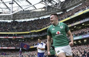 Ireland's Jacob Stockdale celebrates scoring a try against Scotland during the Six Nations rugby match at the Aviva Stadium in Dublin, Ireland, Saturday March 10, 2018. (Brian Lawless/PA via AP)